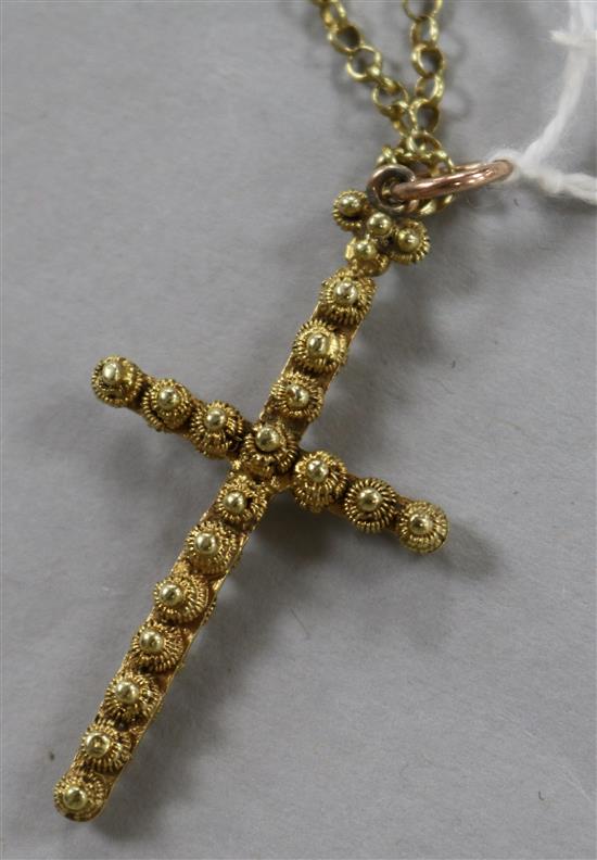 A Victorian yellow metal cross pendant on a yellow metal chain, pendant 45mm.